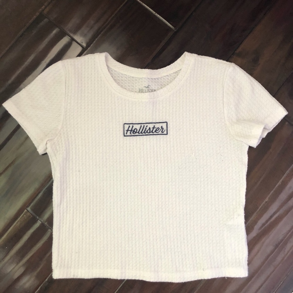 White Hollister Top with Blue Word On The Front